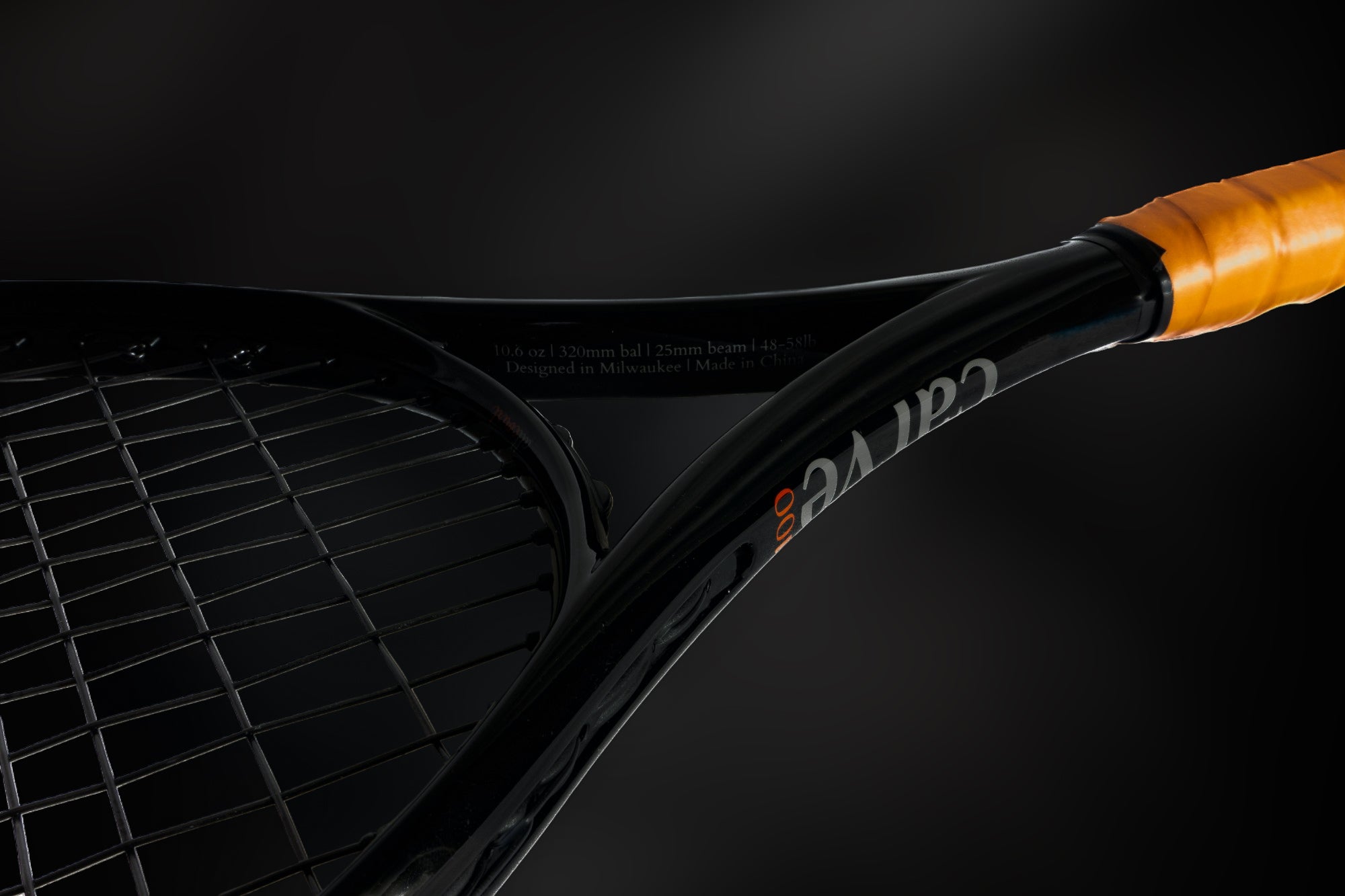 Close up of carve allcourt 100 tennis racket with dark background