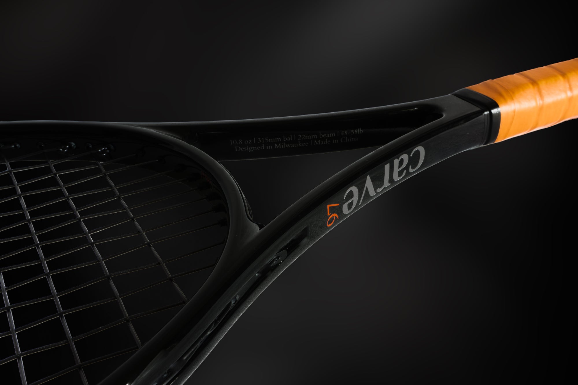 Carve adtouch 97 tennis racket up close with dark background