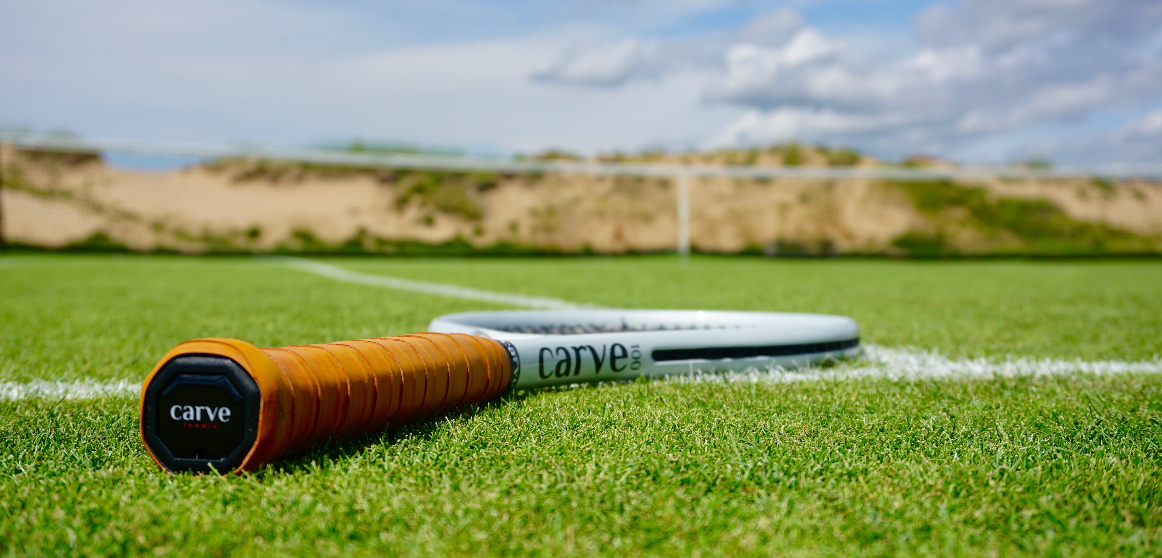 Carve Sports Lightspeed tennis racket on grass